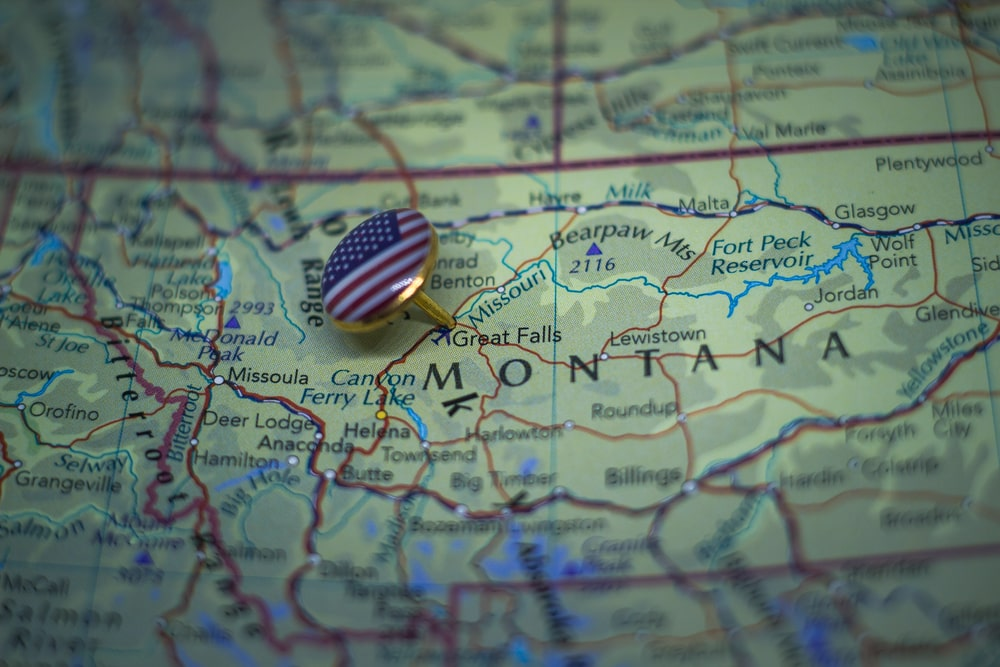 Montana map with a US flag pinning Great Falls