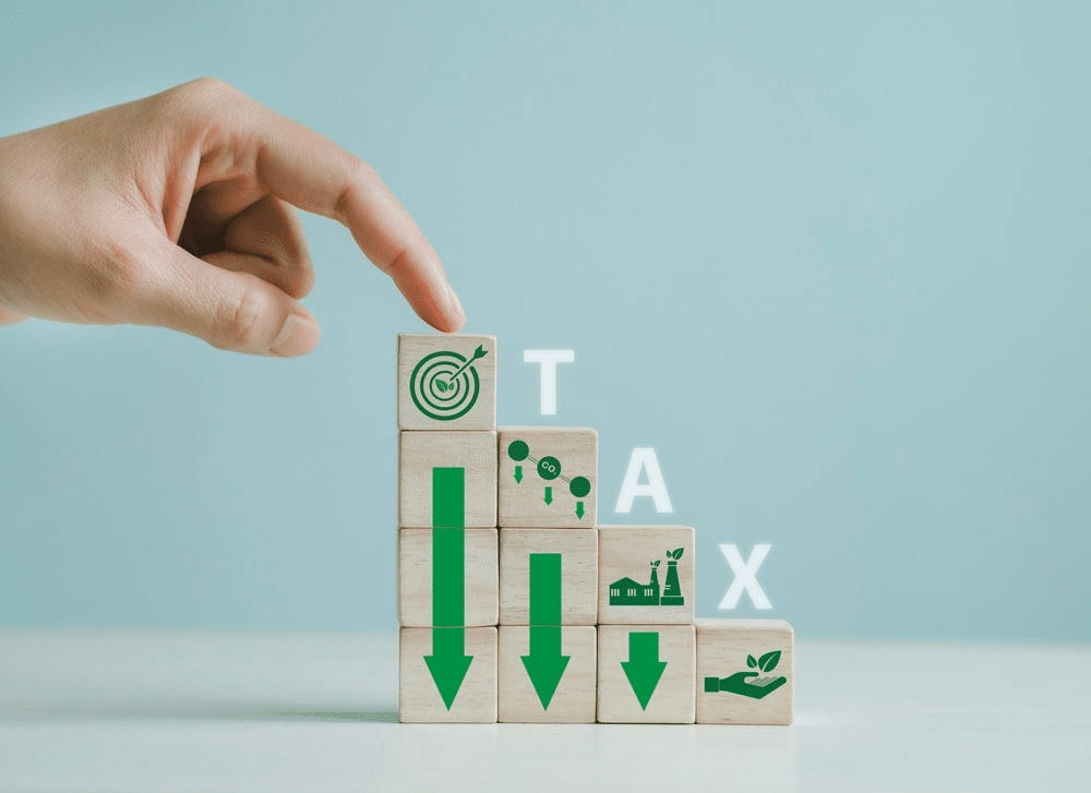 blocks with arrow down and the word tax