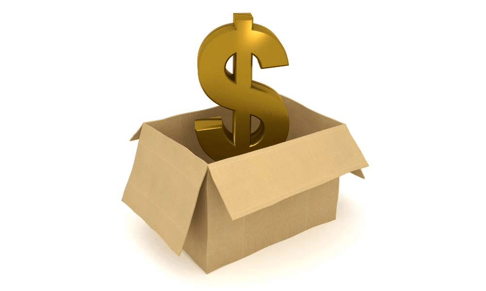 Gold dollar sign emerging from an open cardboard box.